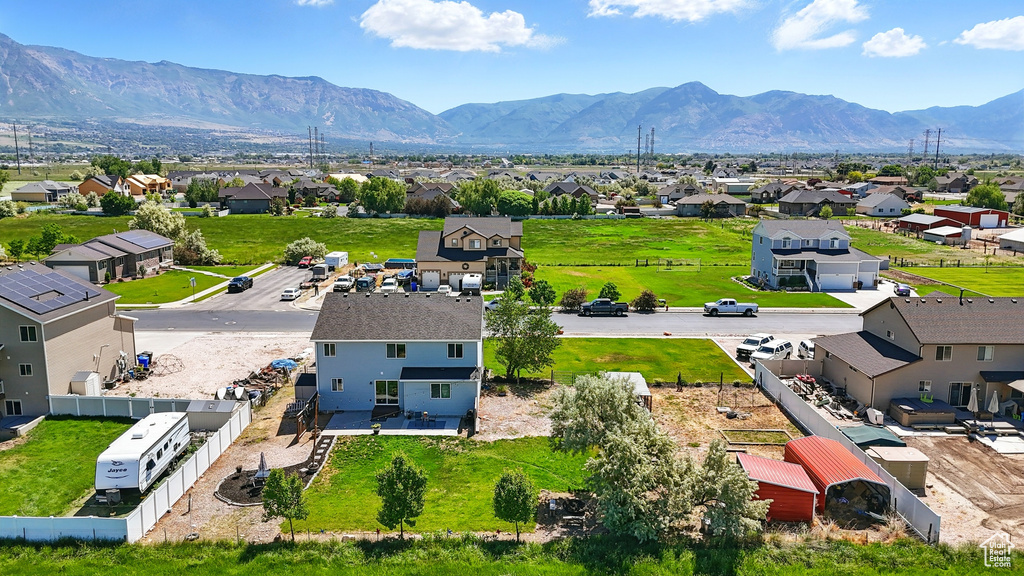 Aerial perspective of suburban area featuring a mountainous background