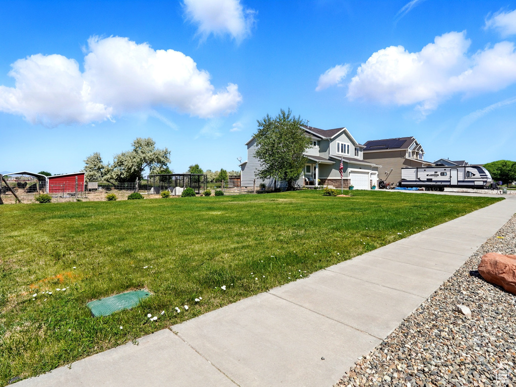 View of yard with a garage
