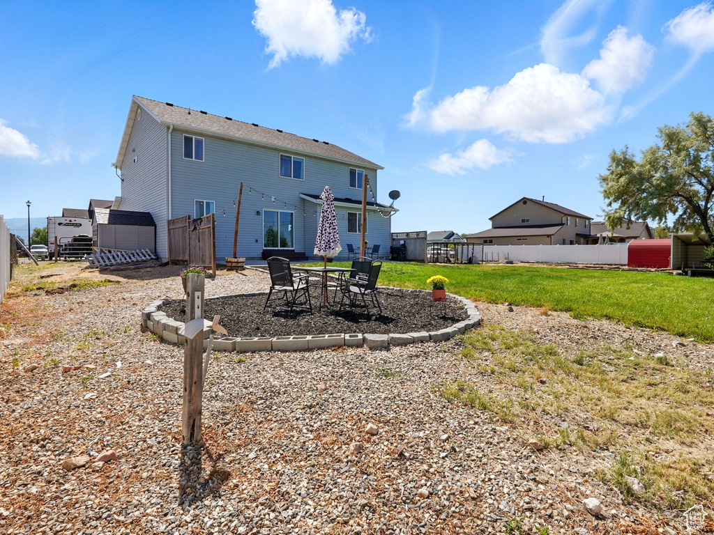 Rear view of property with a patio