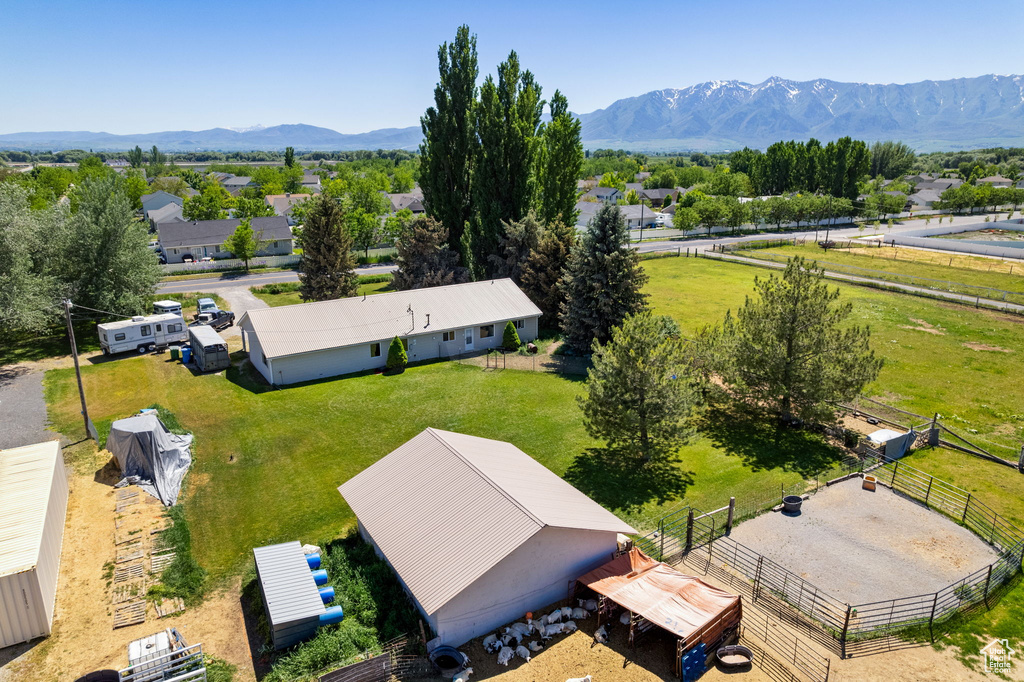 Overview of rural landscape featuring a mountain backdrop