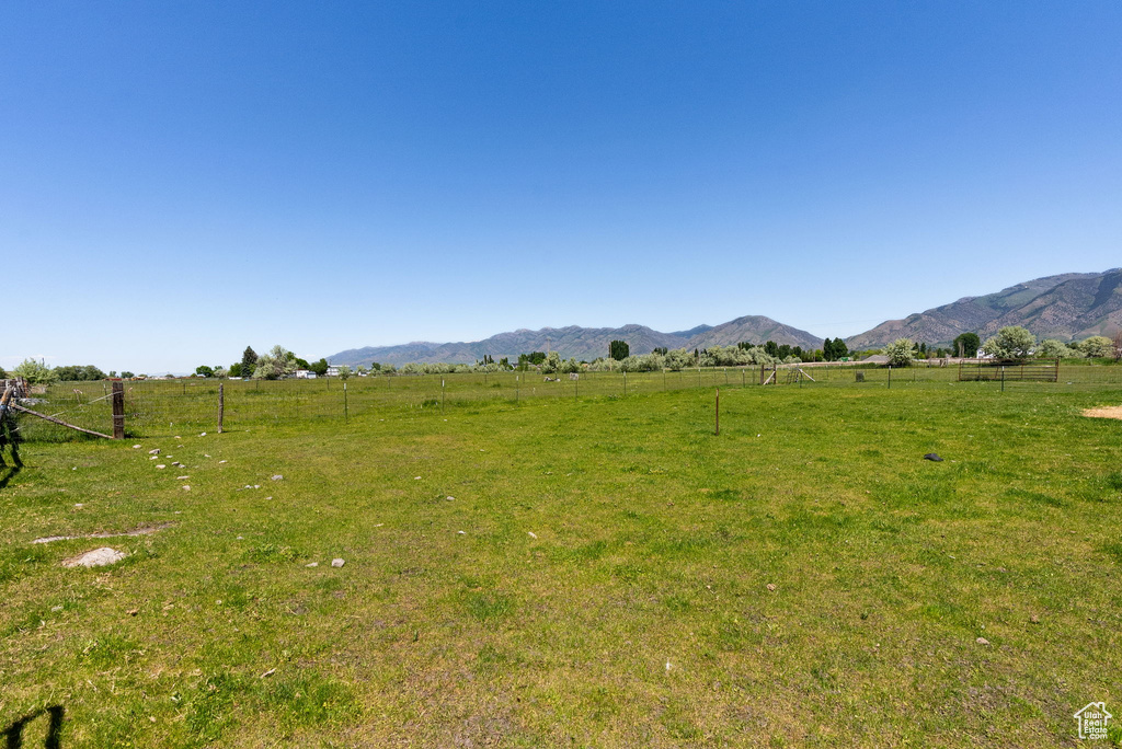 View of yard featuring a view of countryside and a mountain view