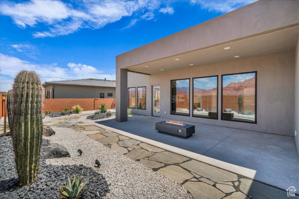 View of patio / terrace with an outdoor fire pit