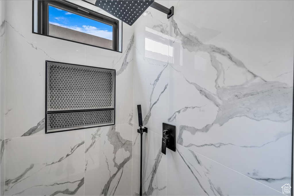 Bathroom view of a marble finish shower