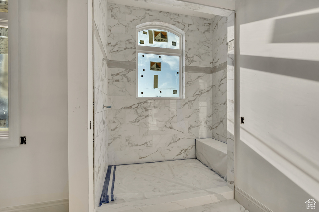 Bathroom featuring marble finish floors