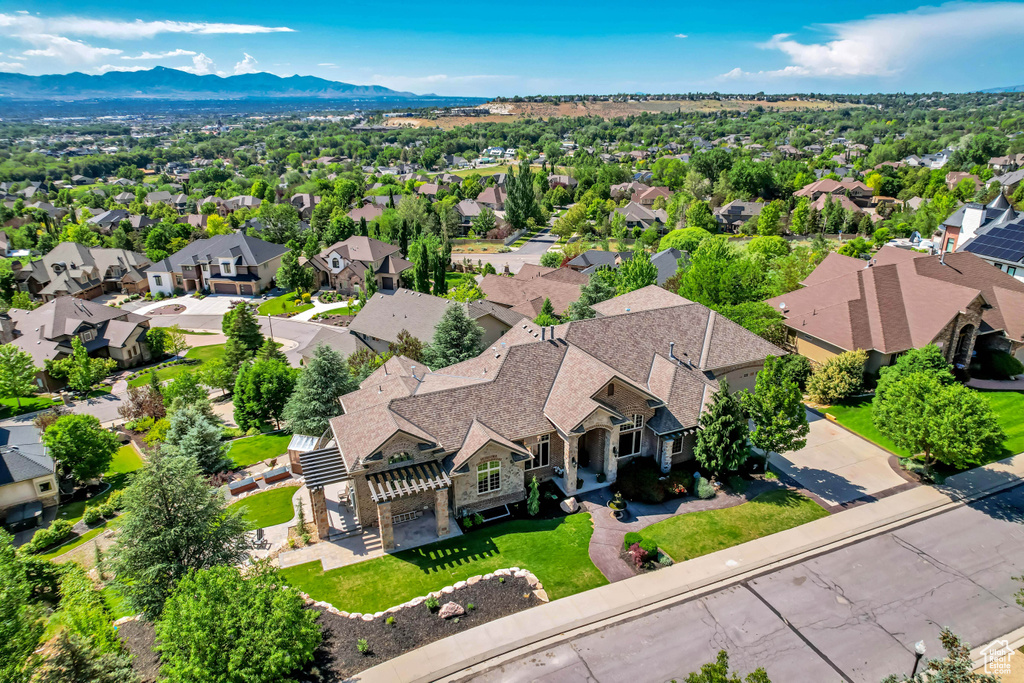 Aerial perspective of suburban area with a mountain backdrop