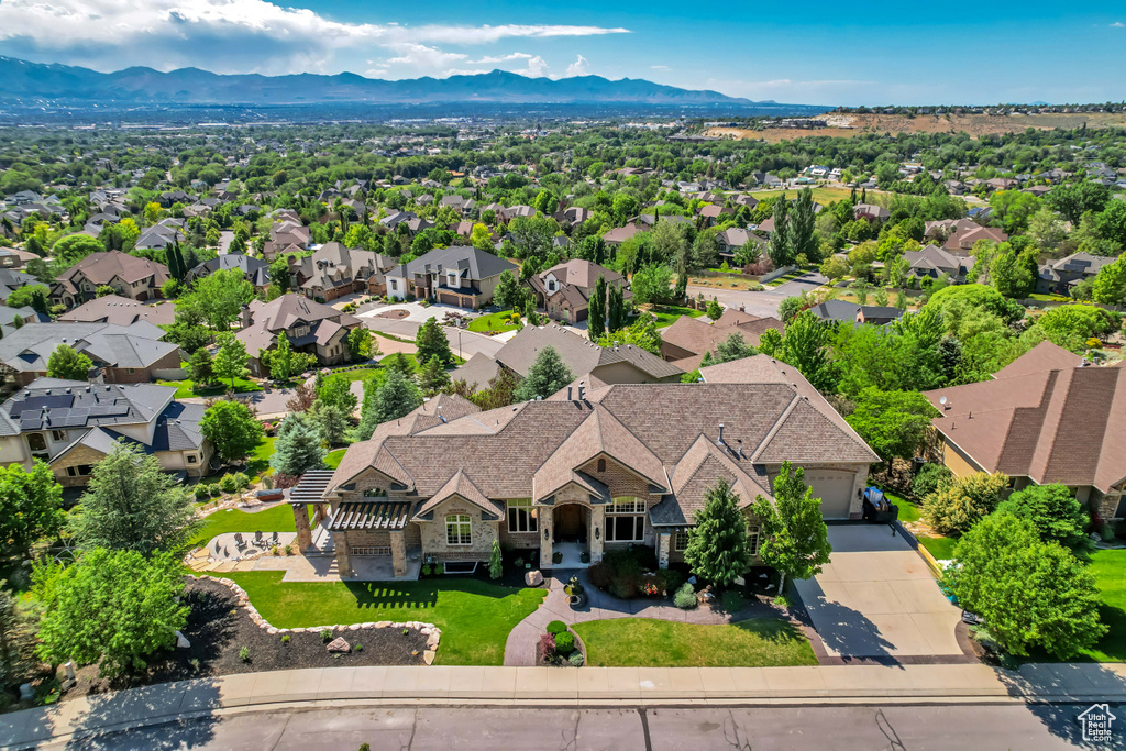Aerial view of residential area featuring a mountainous background
