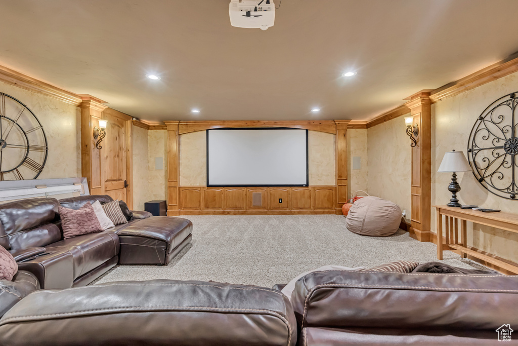 Cinema featuring carpet floors, decorative columns, crown molding, and recessed lighting