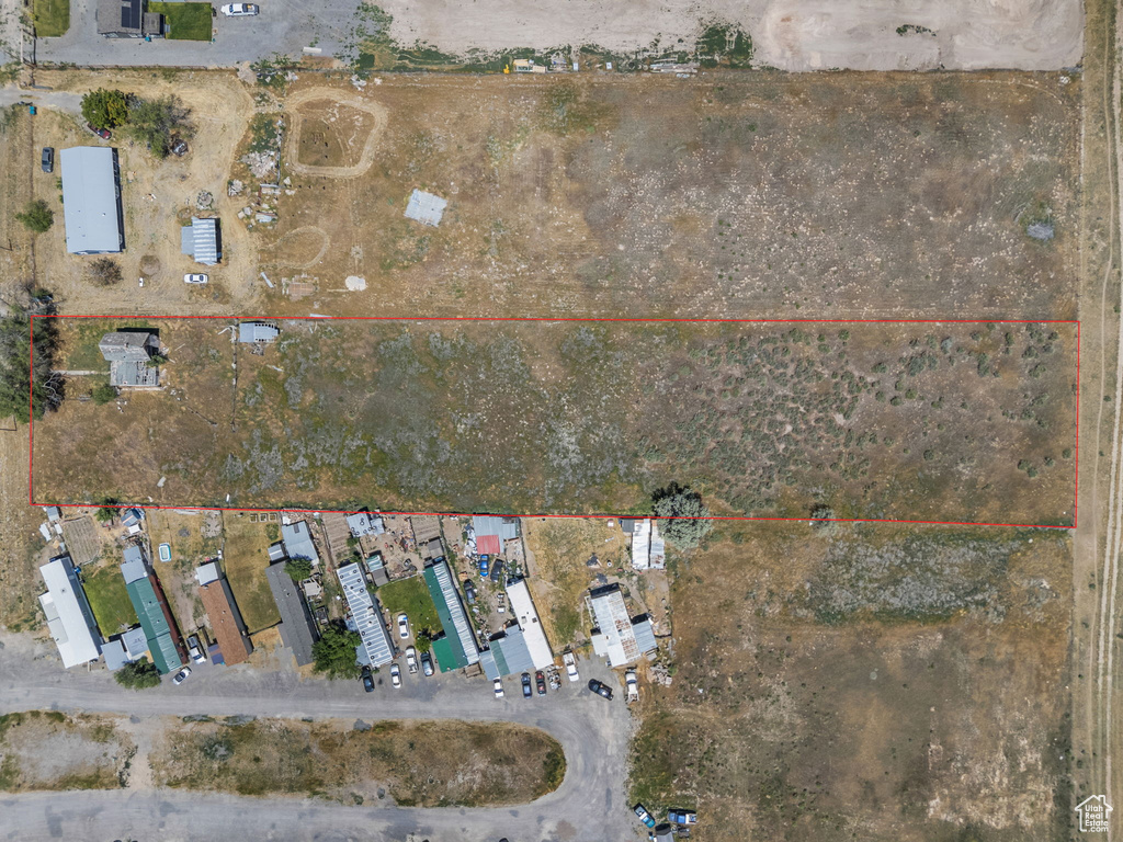 Aerial view of property and surrounding area with property boundaries highlighted