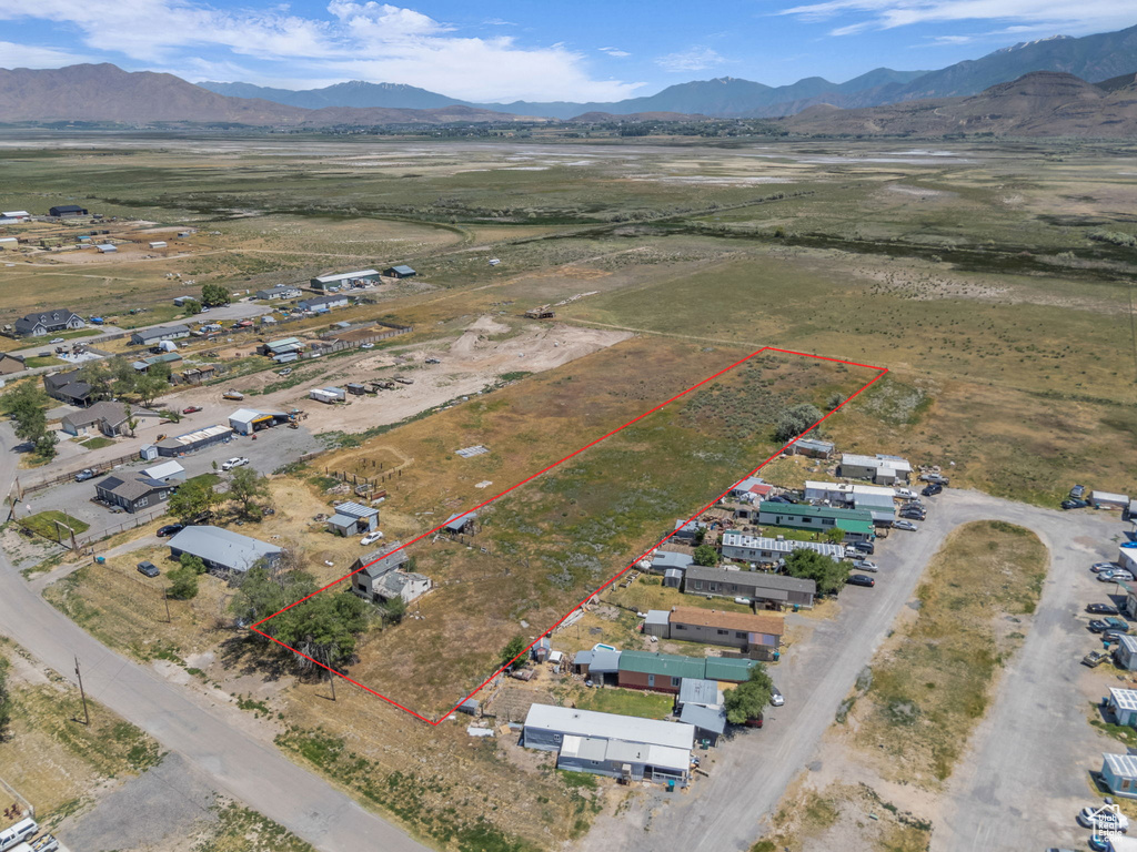 View of rural area with property parcel outlined and a mountain backdrop