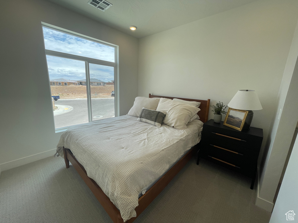 Bedroom featuring carpet, baseboards, and recessed lighting