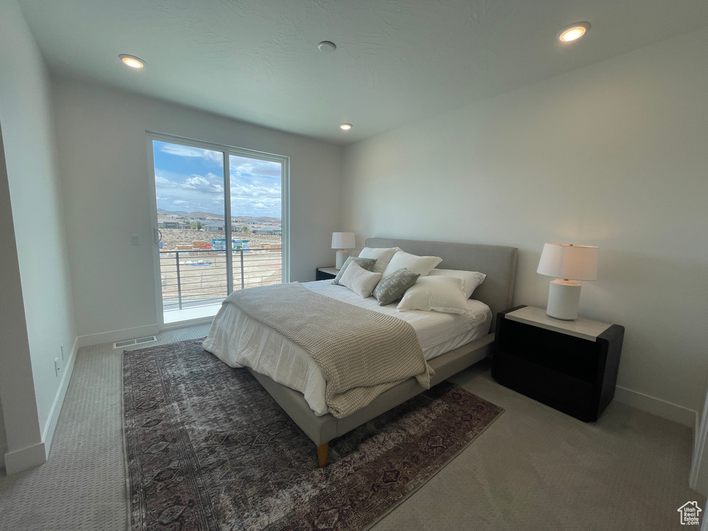 Carpeted bedroom with access to outside, baseboards, and recessed lighting