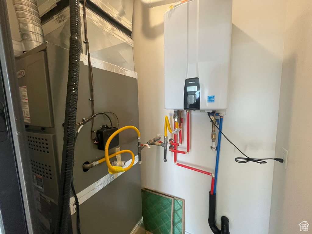Utilities with tankless water heater and heating unit