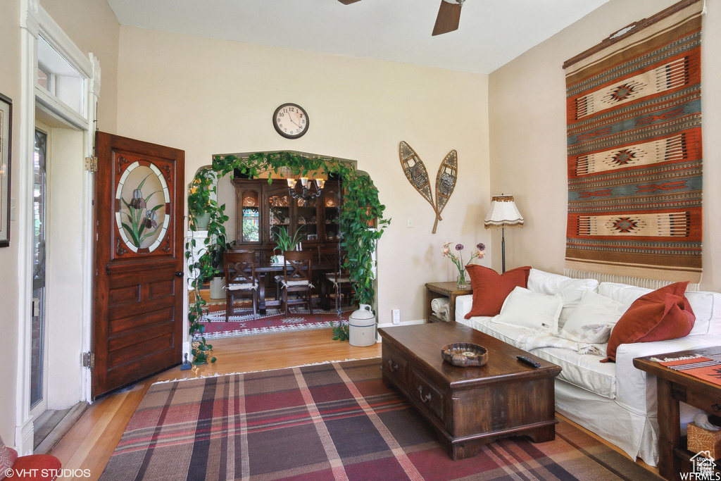 Living room featuring wood finished floors and ceiling fan