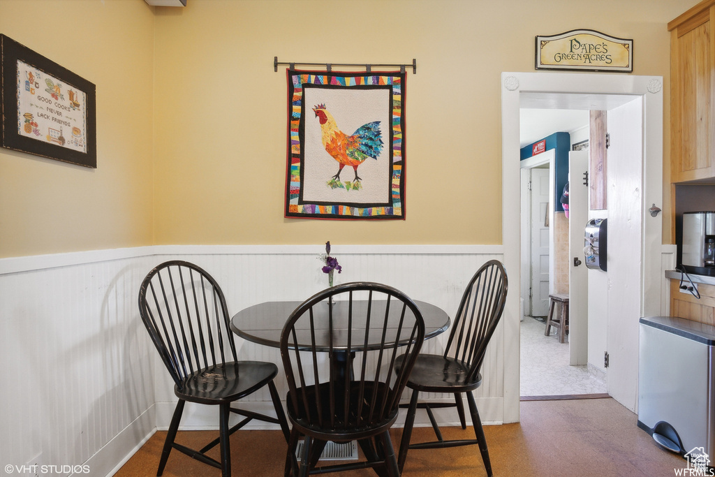 Dining room featuring a wainscoted wall