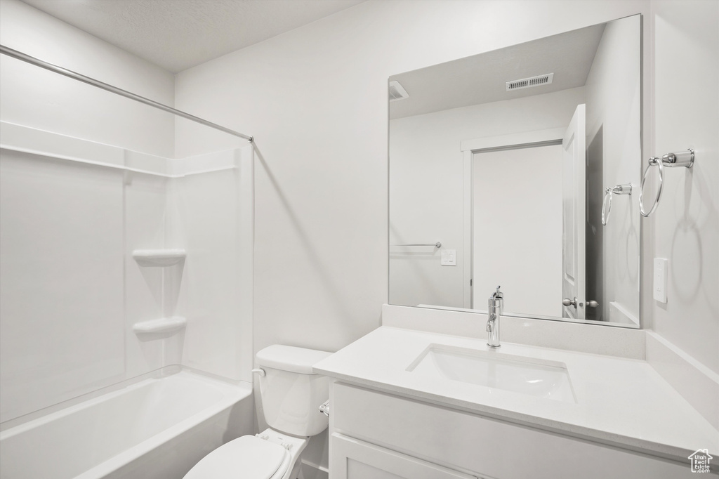 Full bath featuring vanity and shower / bath combination