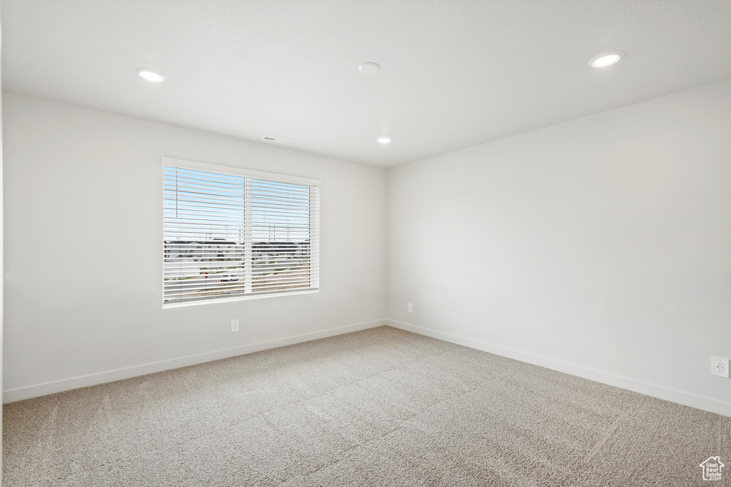 Unfurnished room featuring carpet floors and recessed lighting