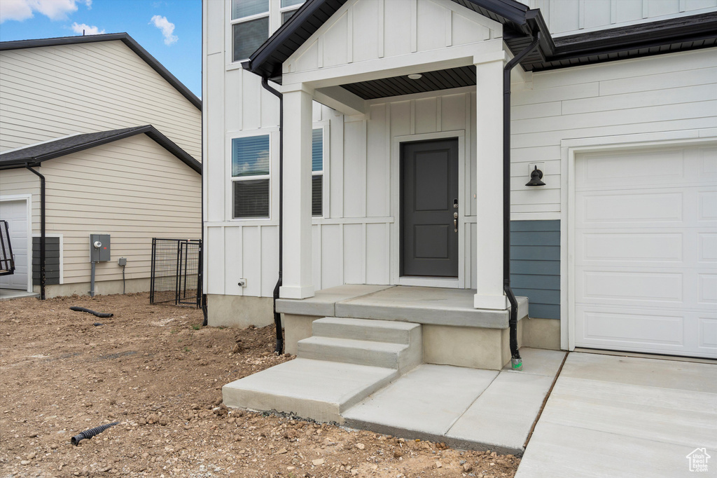 Doorway to property with board and batten siding