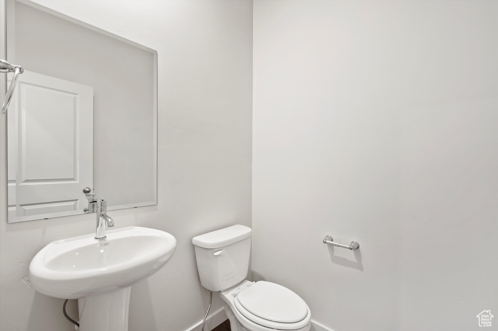 Half bathroom with baseboards
