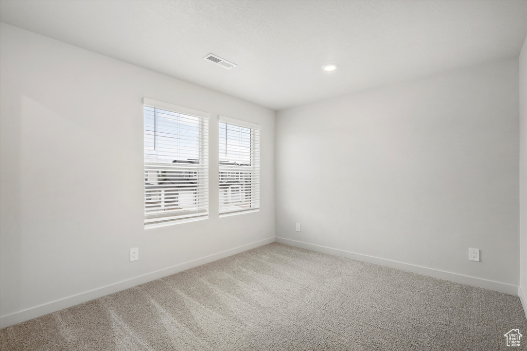 Unfurnished room with carpet and recessed lighting