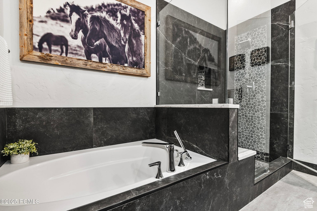 Bathroom with a garden tub and a walk in shower