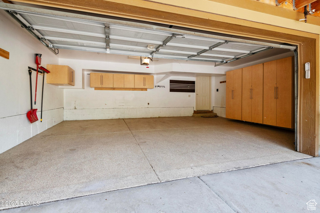 Garage featuring a garage door opener