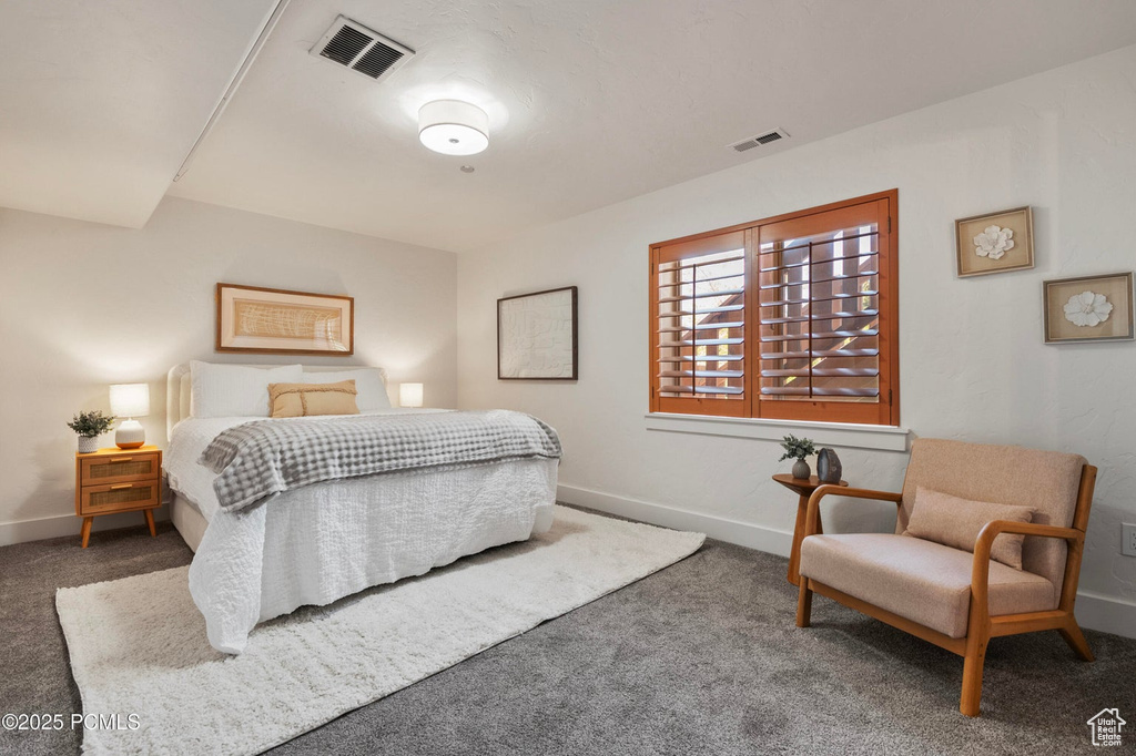 Bedroom with carpet and baseboards