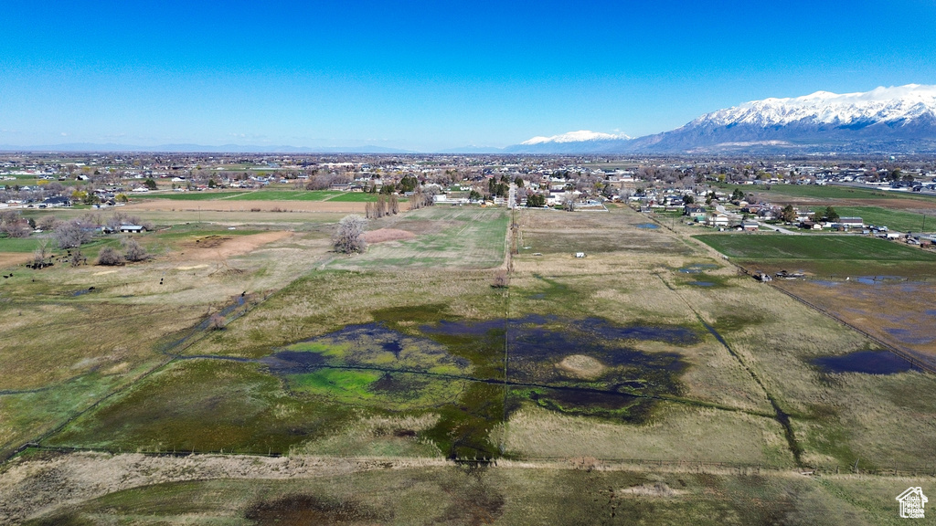 Aerial view of property's location with a mountain backdrop