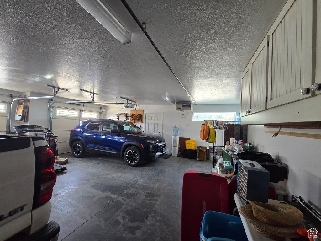 Garage with a garage door opener and a heating unit