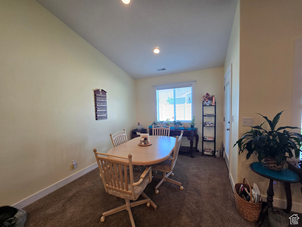 Dining area featuring carpet, vaulted ceiling, baseboards, and recessed lighting