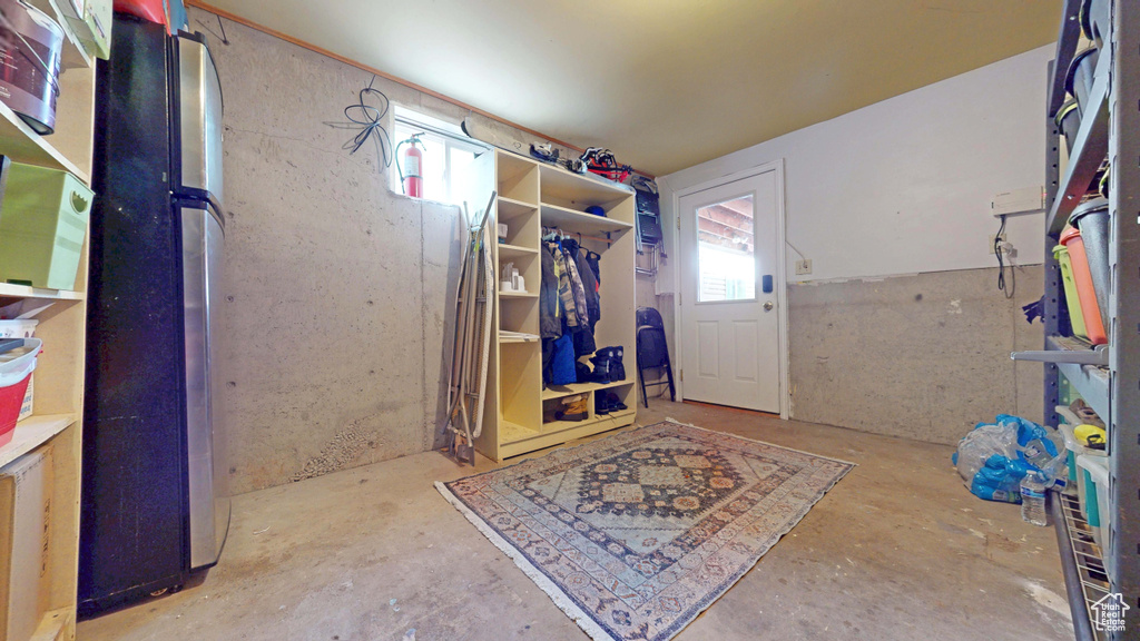 Mudroom featuring concrete flooring