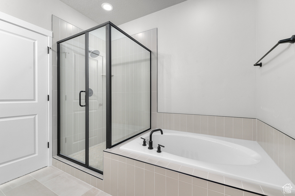 Bathroom with a garden tub and a stall shower