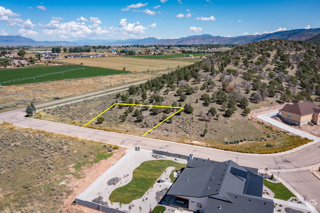 Aerial view of sparsely populated area featuring a mountain backdrop