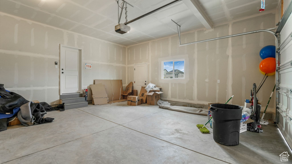 Garage featuring a garage door opener