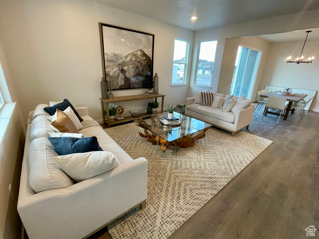 Living room featuring a chandelier and wood finished floors