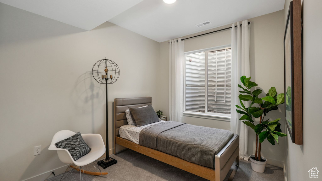 Bedroom with carpet floors and baseboards