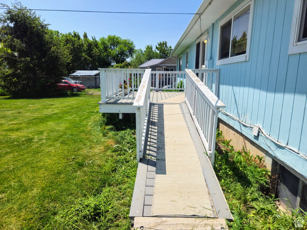 Wooden terrace with a lawn