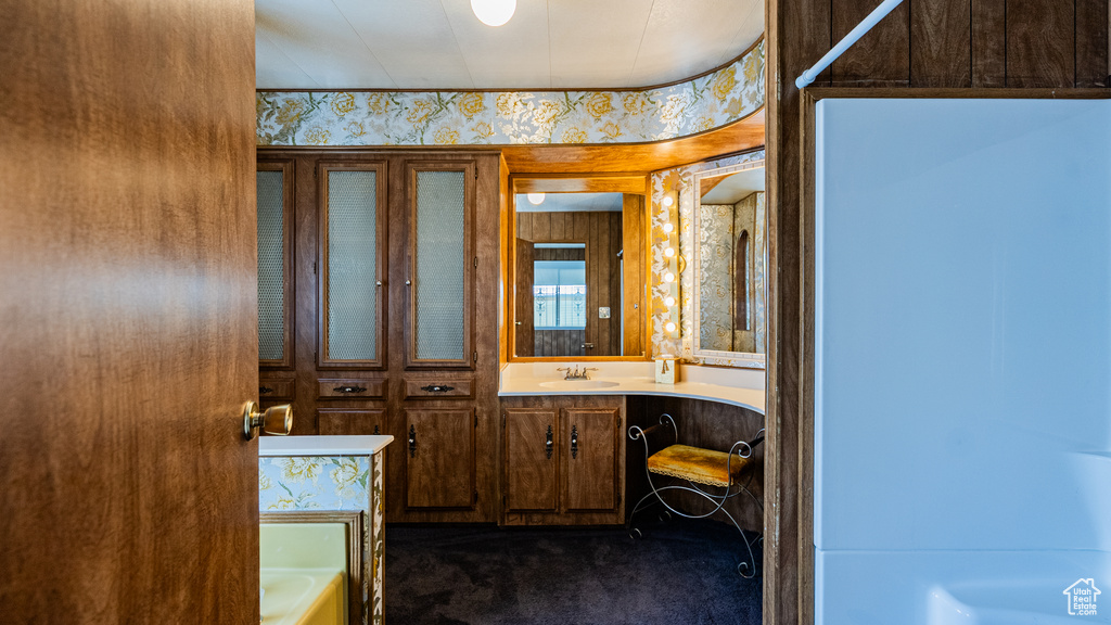Full bathroom featuring a bathtub and vanity