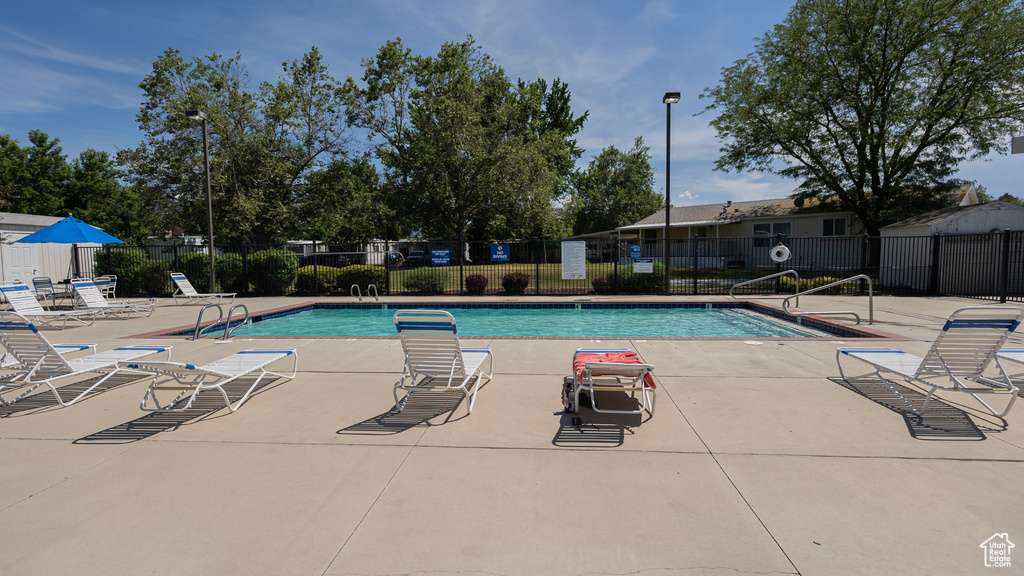 Community pool with a patio area