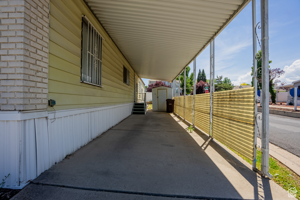 View of patio featuring a carport