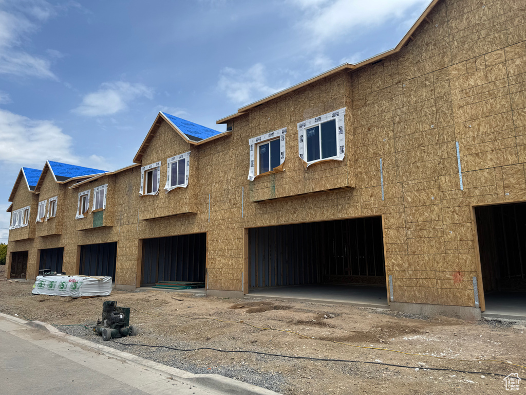 View of front of property featuring a garage