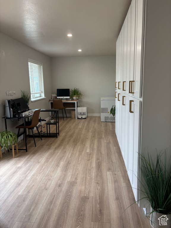 Office area with light wood finished floors, recessed lighting, and baseboards