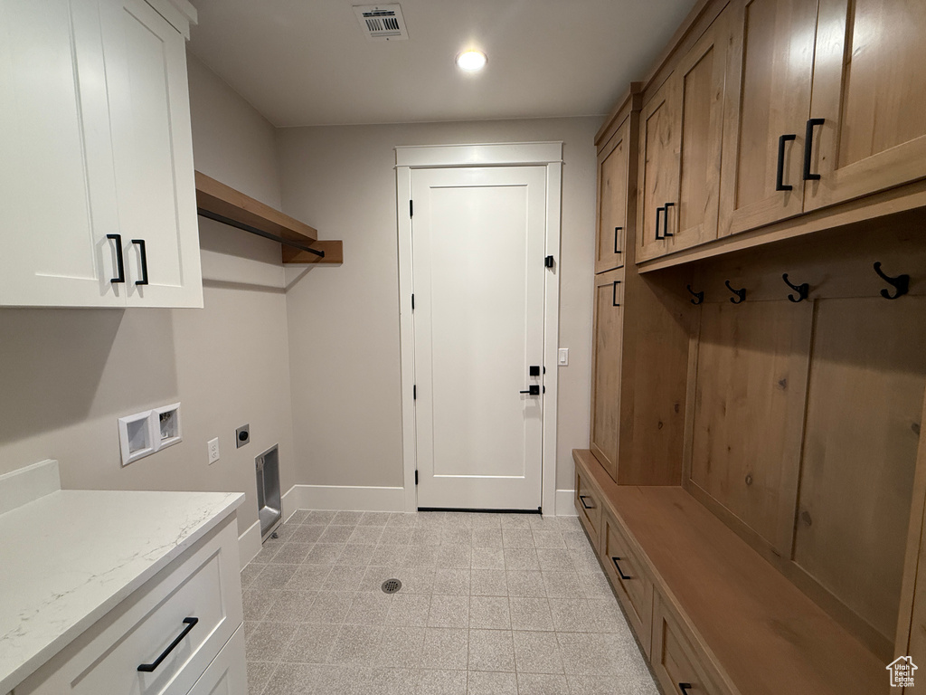 Laundry room featuring baseboards, cabinet space, washer hookup, recessed lighting, and electric dryer hookup