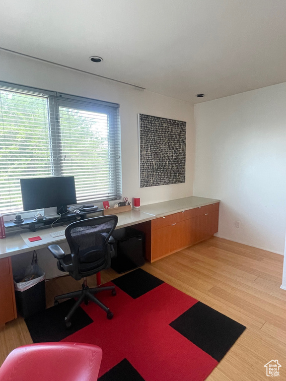 Office area featuring light wood-style floors