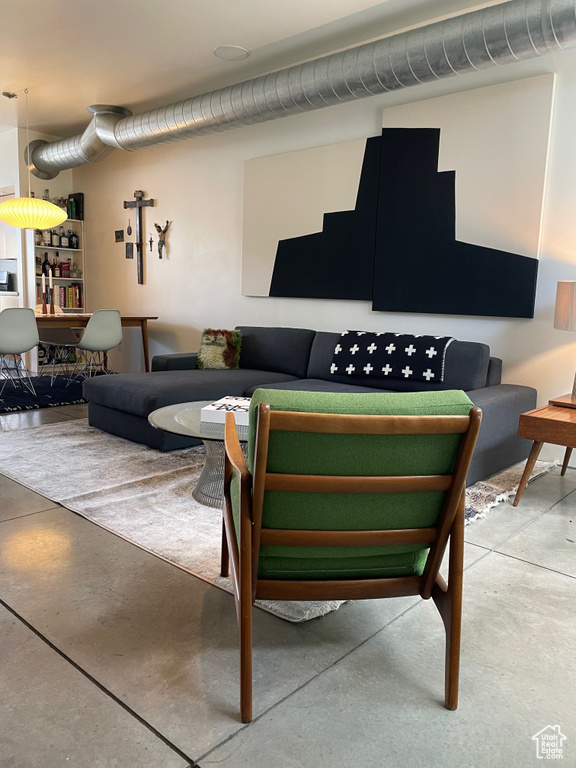 Living area featuring concrete flooring