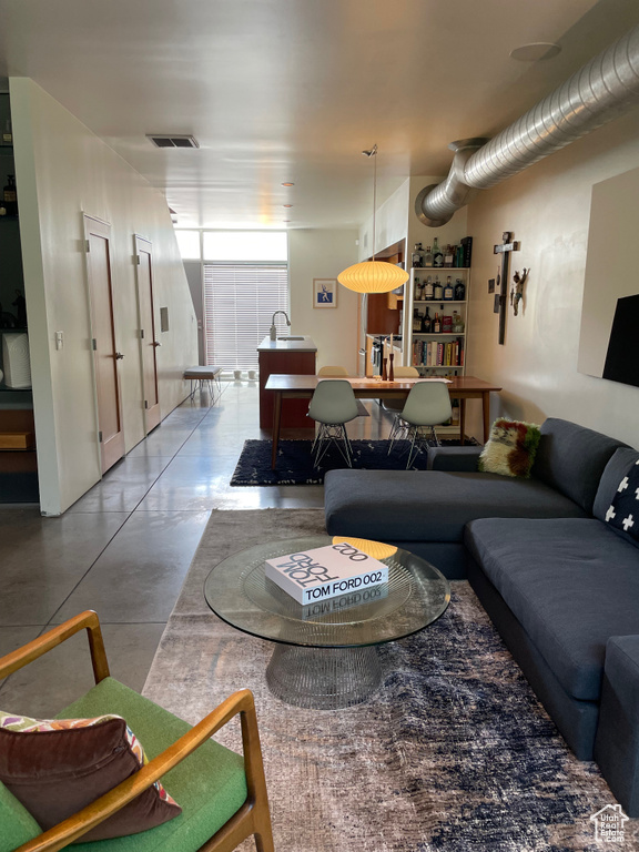 Living room with finished concrete flooring