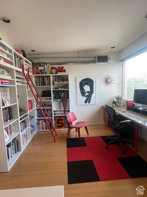 Home office featuring wood finished floors