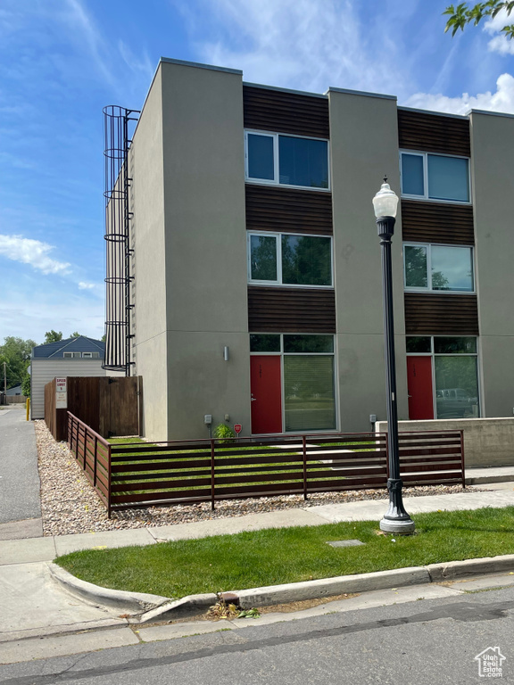 View of property with a fenced front yard