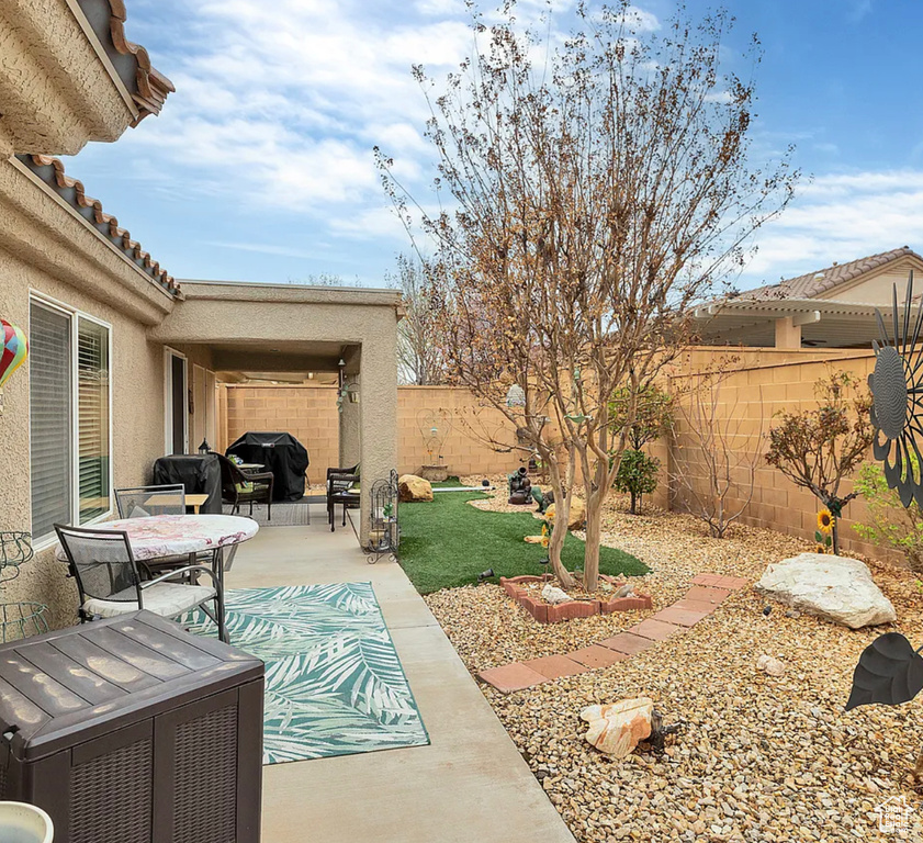 Fenced backyard featuring a patio area
