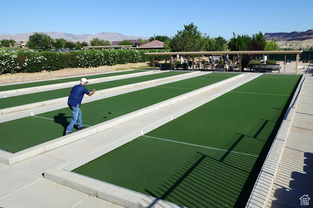 Surrounding community with a bocce ball area and a mountain view