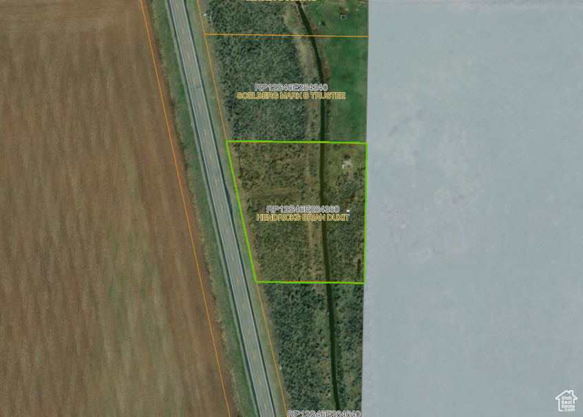 Aerial view of property\'s location with property parcel outlined